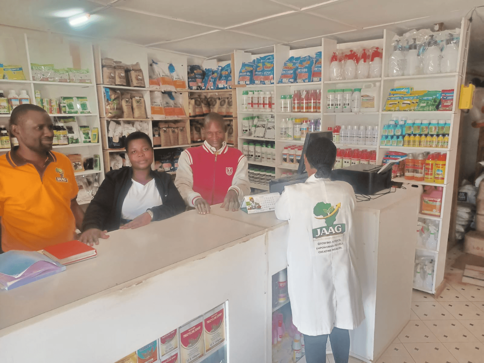 JAAG team members assisting customers at the agroveterinary store counter